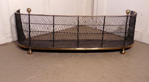 A Victorian Brass and Iron Club Fender