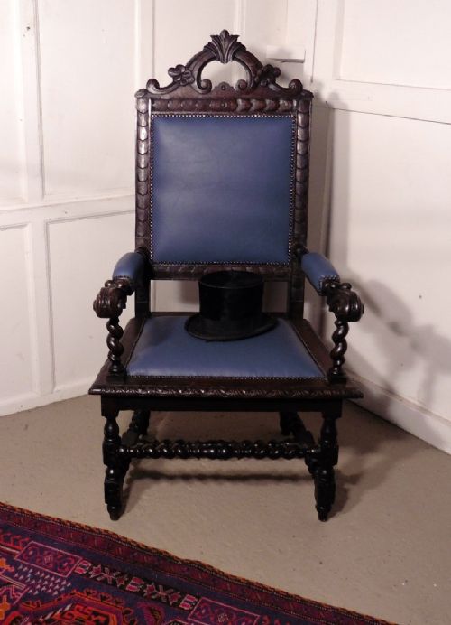 A Very Large Victorian Carved Oak and Leather Arm Chair.