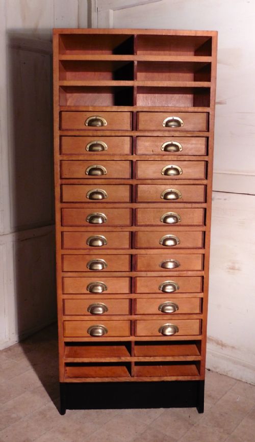 A Tall Art Deco Oak Filing Cabinet, Haberdashers Shelves