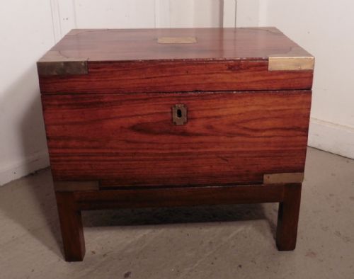 A 19th Century Mahogany Campaign Chest, Necessaire and Coffee Table