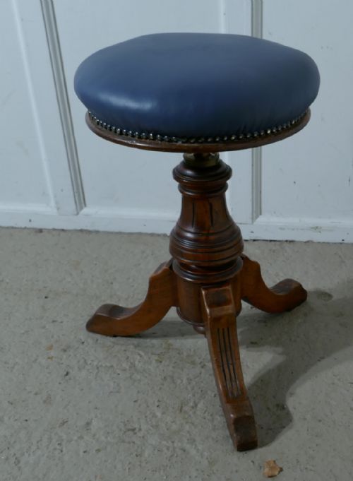 An Elegant Victorian Walnut Swivel Piano Stool