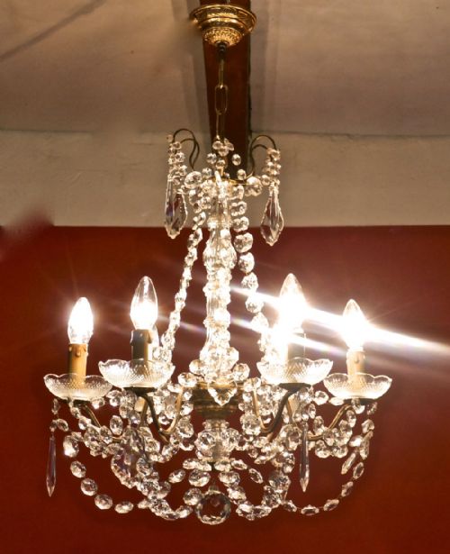A Charming French Crystal 6 Branch Brass Chandelier