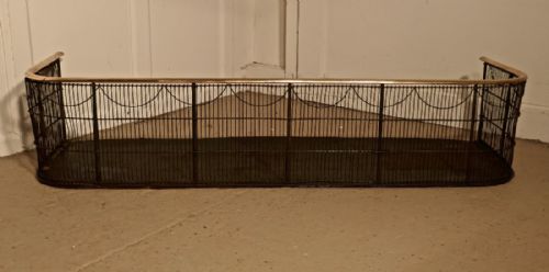 A Georgian Brass and Iron Club Fender or Nursery Fire Guard