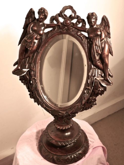 A 19th Century Gothic Walnut Vanity Mirror, Carved with Angels