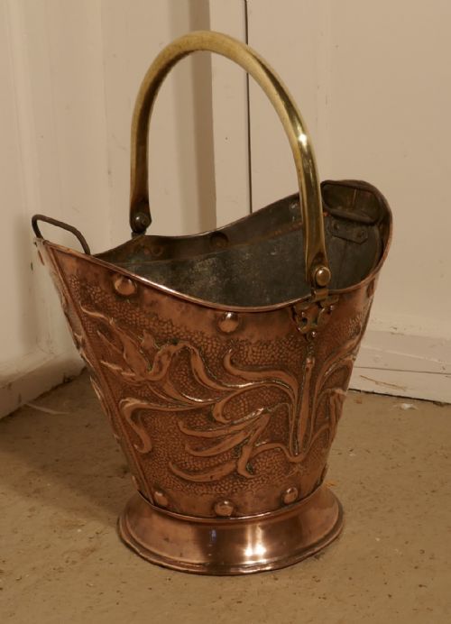 fig 2. An Art Nouveau Embossed Copper Helmet Coal Scuttle with Liner