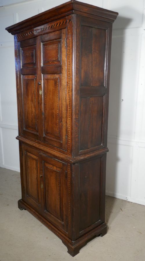 fig 1. An 18th Century Inlaid Oak Estate or Housekeepers Cupboard