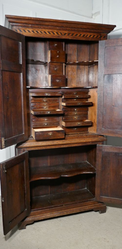 fig 2. An 18th Century Inlaid Oak Estate or Housekeepers Cupboard