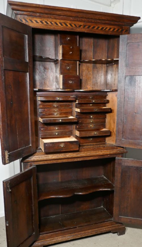 fig 3. An 18th Century Inlaid Oak Estate or Housekeepers Cupboard