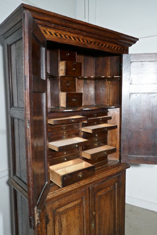 fig 4. An 18th Century Inlaid Oak Estate or Housekeepers Cupboard