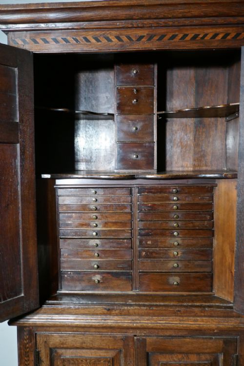 fig 5. An 18th Century Inlaid Oak Estate or Housekeepers Cupboard