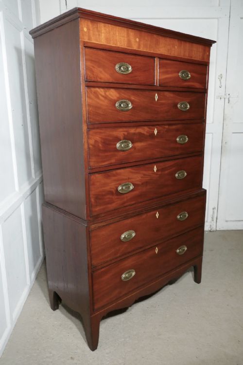 fig 6. A Georgian Flame Mahogany Chest on Chest, with Inlay to the Cornice