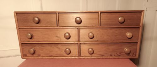 A  Small Victorian Pine Collectors Cabinet or Filing Drawers