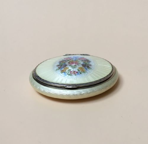 fig 3. Sterling Silver Guilloche Enamel Compact Case, with a Garland of Flowers