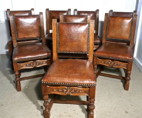 fig 1. Set of 8, 19th Century Carved Oak and Leather Dining Chairs