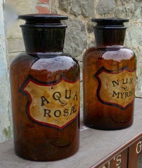 fig 4. A Pair of Amber Glass Chemist Jars, Large Stoppers