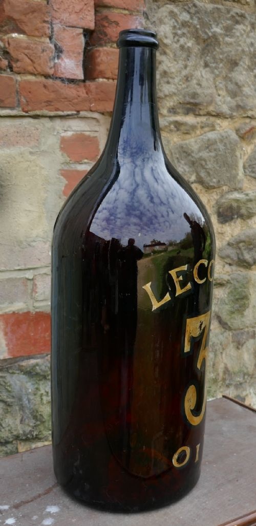 fig 2. Giant 19th Century Italian Olive Oil Bottle with Gold Number and Lable