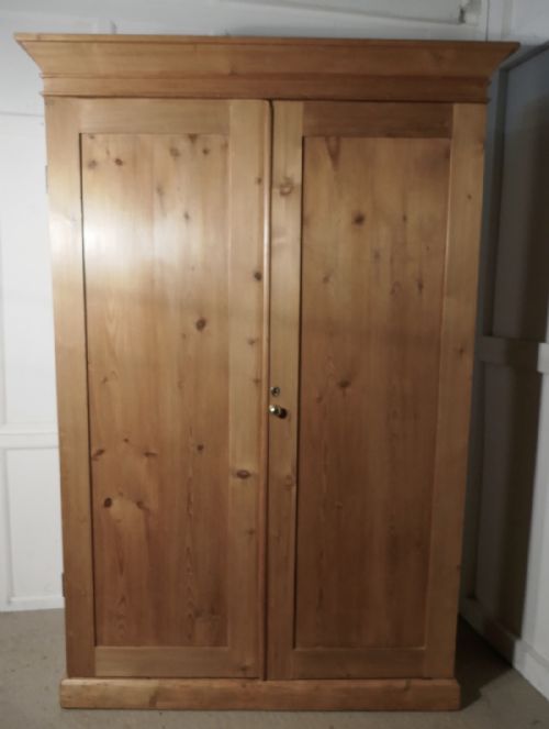 A Victorian Stripped Pine Wardrobe Compactum