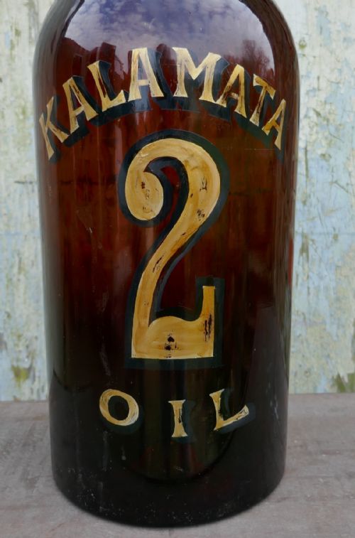 fig 1. Giant 19th Century Greek Olive Oil Bottle with Gold Number and Lable