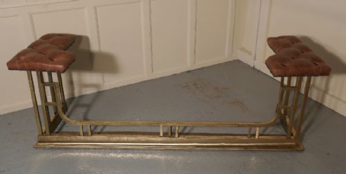 A Large Brass and Leather Club Fender