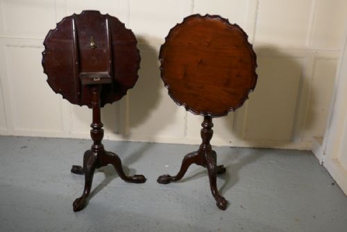 A Pair of Georgian Mahogany Tripod Wine Tables with a Pie Crust Edge