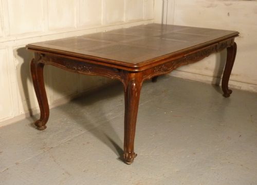 A Large French Oak Draw Leaf Table