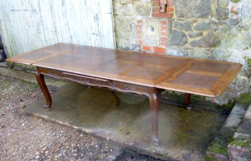 fig 3. A Large French Oak Draw Leaf Table