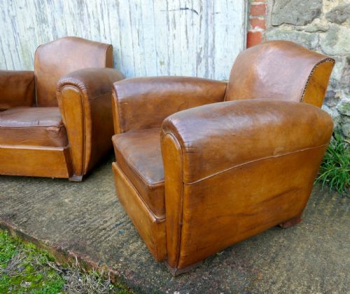 A Pair of French Art Deco Shabby Leather Club Chairs