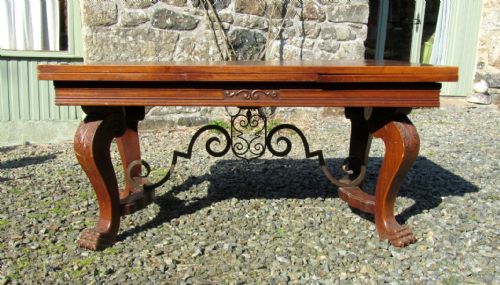 A Large 19th Century Carved and Parquetry Oak Draw Leaf Table