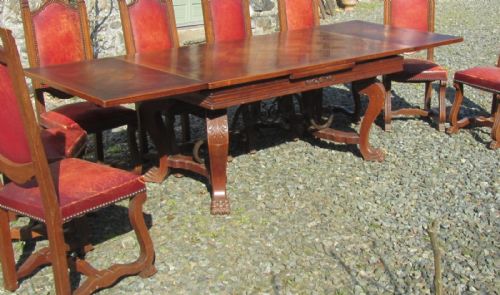 fig 4. A Large 19th Century Carved and Parquetry Oak Draw Leaf table
