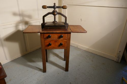 A 19th Century, Cast Iron Flower or Book Press, on Original Mahogany Table