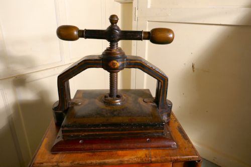 fig 1. A 19th Century, Cast Iron Flower or Book Press, on Original Mahogany Table