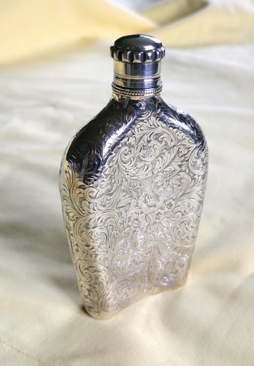 fig 1. A Decoratively Engraved Victorian Silver Spirit Flask, Hilliard & Thomason 1861