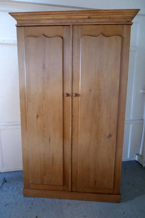 An Early Victorian Stripped Pine Wardrobe