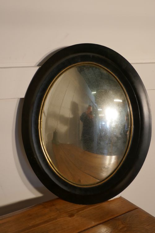 Regency Style Ebonised Convex Oval Wall Mirror