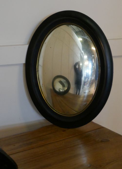 Regency Style Ebonised Convex Oval Wall Mirror