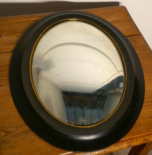 fig 2. Regency Style Ebonised Convex Oval Wall Mirror