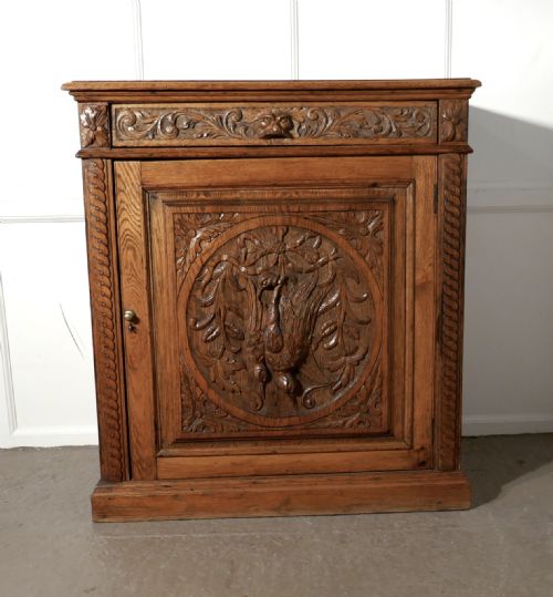 Carved Golden Oak Game Cupboard