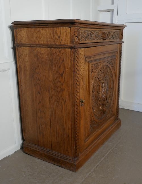 fig 1. Carved Golden Oak Game Cupboard