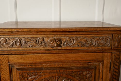 fig 2. Carved Golden Oak Game Cupboard
