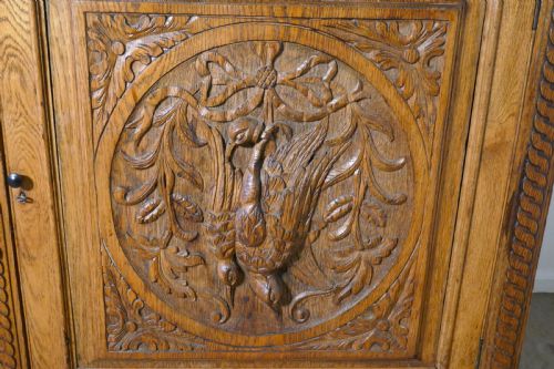 fig 3. Carved Golden Oak Game Cupboard