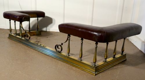 A Large Arts and Crafts Brass and Leather Club Fender
