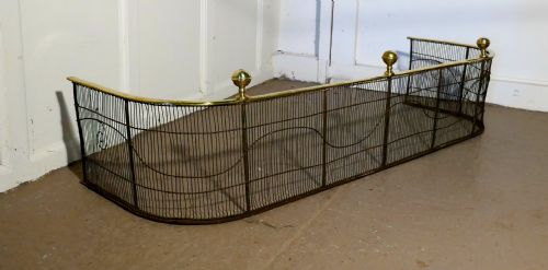 A Georgian Brass and Iron Club Fender