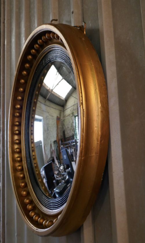 fig 4. A Large Regency Convex Gilt Wall Mirror 