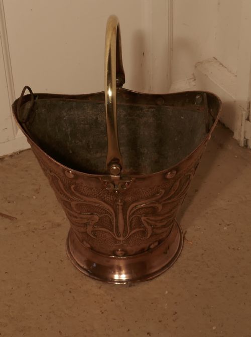 fig 1. An Art Nouveau Embossed Copper Helmet Coal Scuttle with Liner