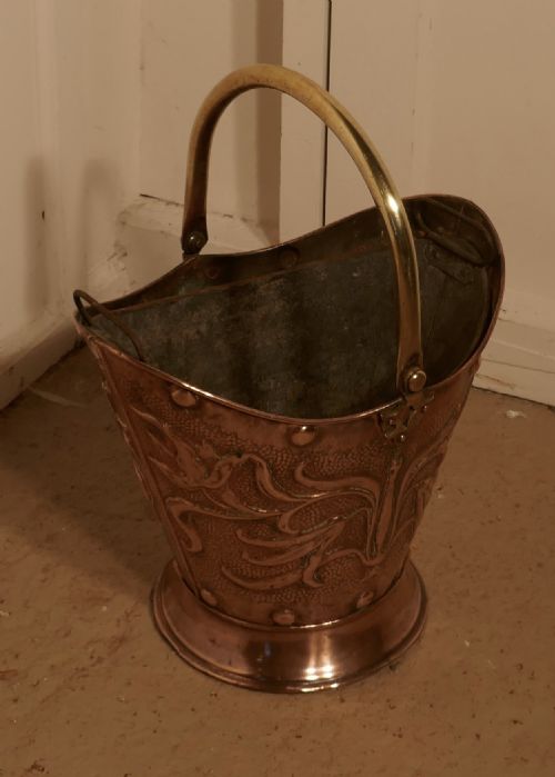 fig 2. An Art Nouveau Embossed Copper Helmet Coal Scuttle with Liner