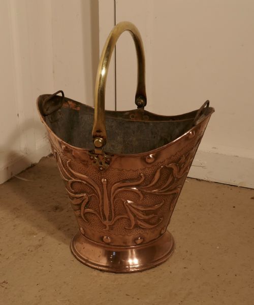 fig 3. An Art Nouveau Embossed Copper Helmet Coal Scuttle with Liner