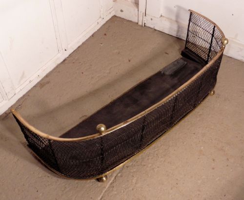 fig 2. A Victorian Brass and Iron Club Fender