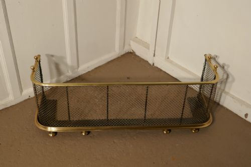 A Victorian Brass and Iron Club Fender