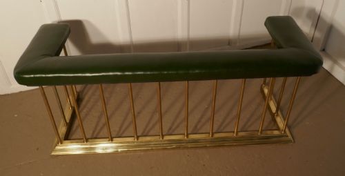 fig 2. A Large Brass and Green Leather Club Fender