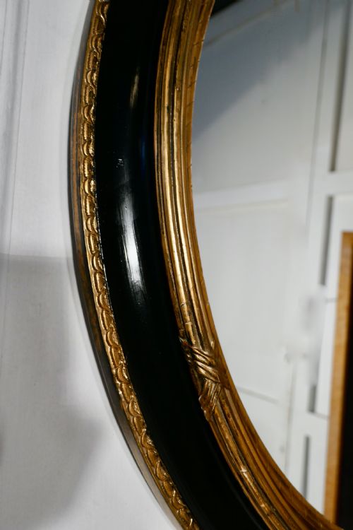 fig 3. A Large French Ebonised and Gilt Oval Wall Mirror